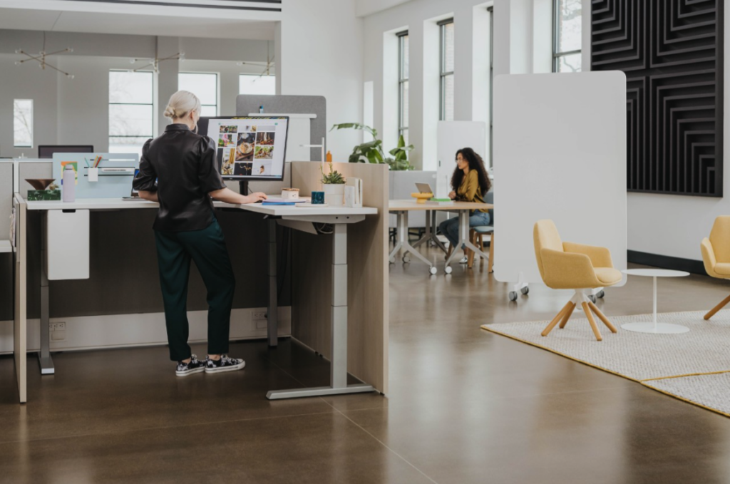 Columbus office with ergonomic standing desks and partitions to optimize the space for focus work. 
